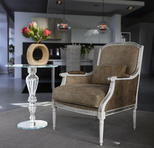 Fauteuil tapissé en cuir gris